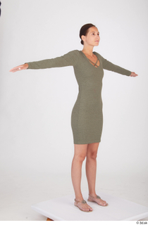 Vanessa Angel casual green long sleeve dress standing t poses…